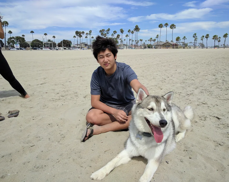 Kyle Duan, electrical hardware engineer, photographed outdoors near the coast.